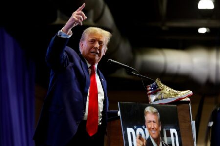 Republican presidential candidate and former President Donald Trump takes the stage to introduce a new line of signature shoes at Sneaker Con at the Philadelphia Convention Center, Feb. 17, 2024, in Philadelphia.