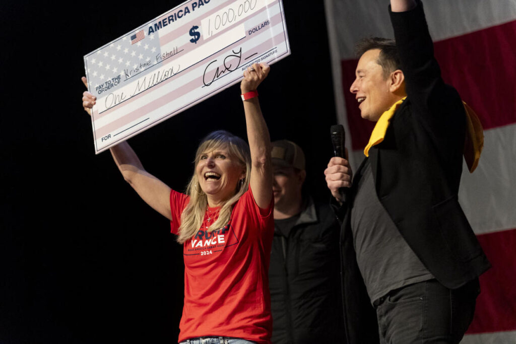 Elon Musk awarded Kristine Fishell a $1 million check at a town hall in Pittsburgh on Oct. 20.